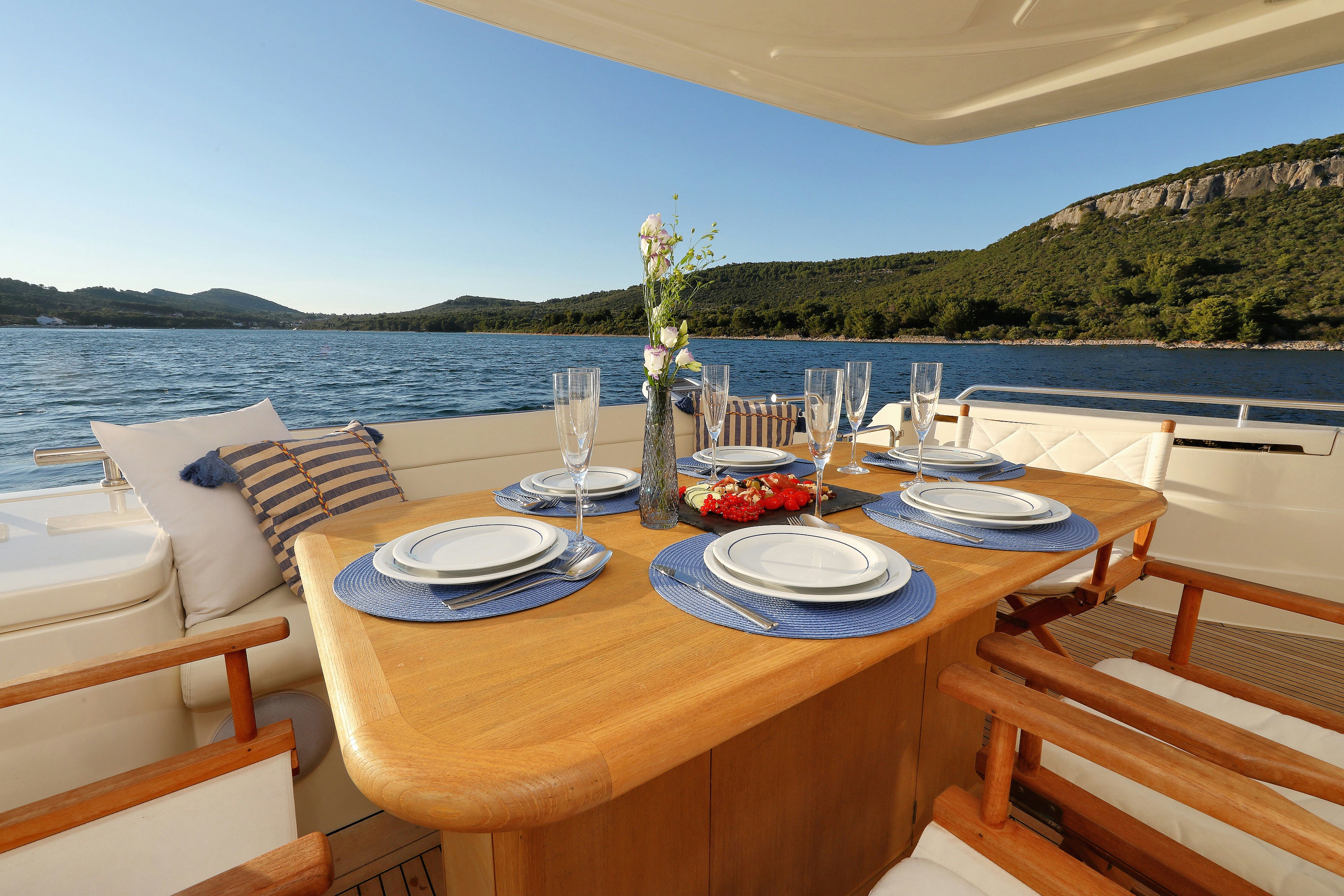Ferretti681 Aftdeck table setup closeup Dubrovnik Yacht Charter